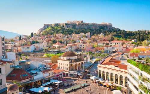 Sightseeingbuss vid Akropolis i Aten